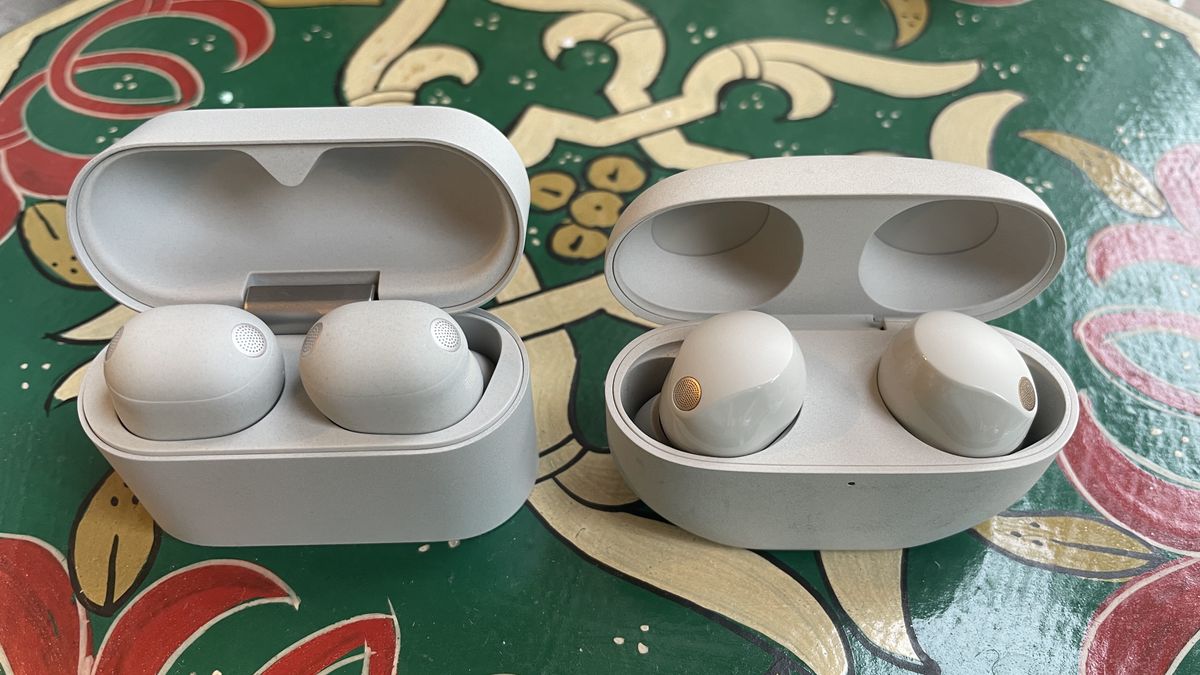 Sony WF-1000XM6 earbuds next to the older-gen. WF-1000XM5 and WF-C710N, on colorful table