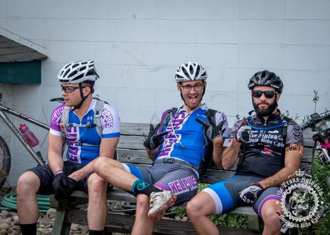 Riders from team Kelpius relax at the start line of stage 3