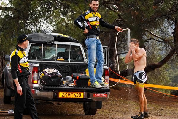 A Team ISD rider showers after the race.