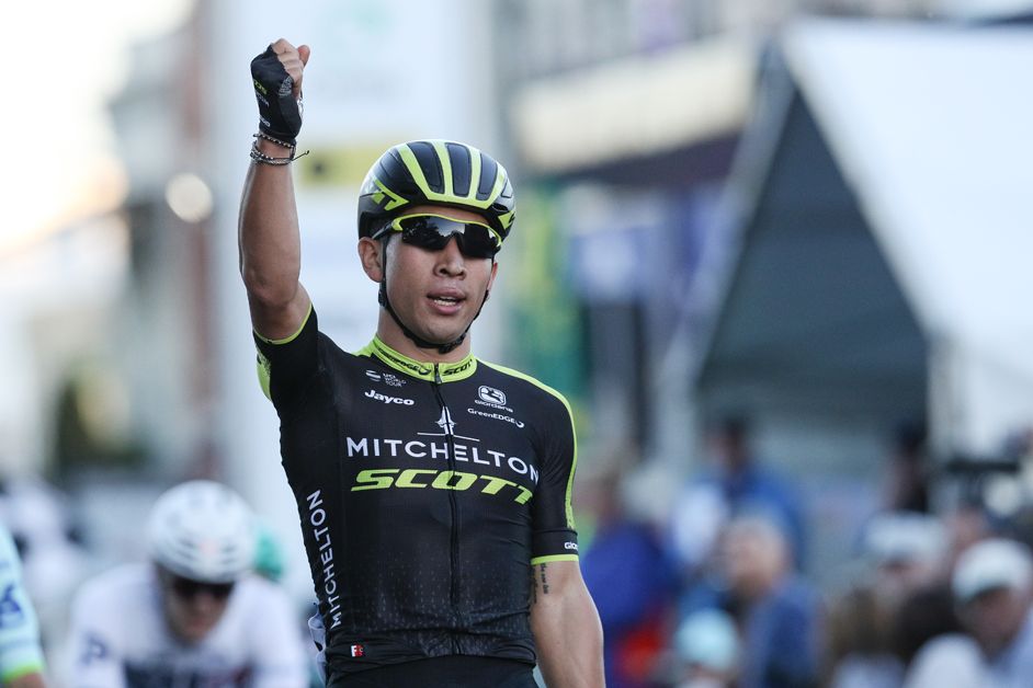 Caleb Ewan sits up and celebrates
