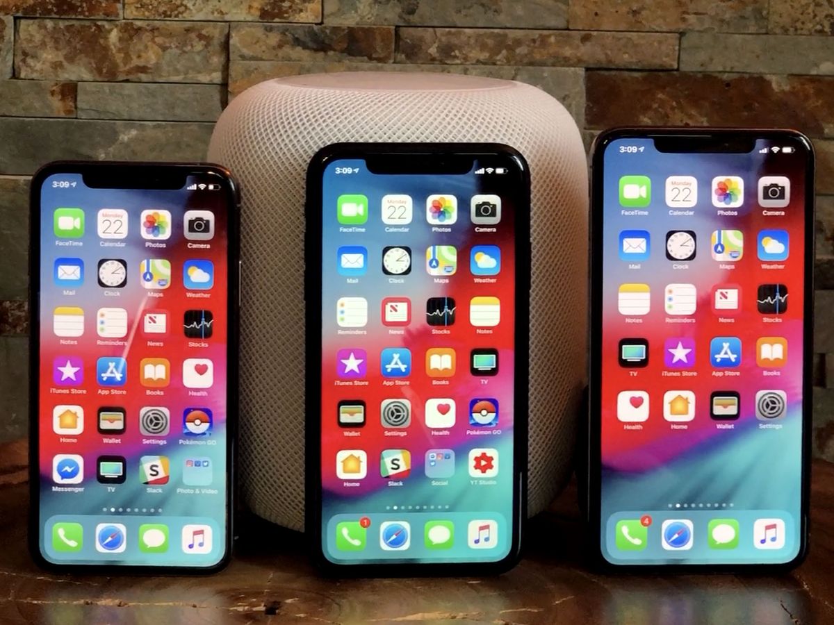 iPhone XS, XR, and Max in front of a white HomePod