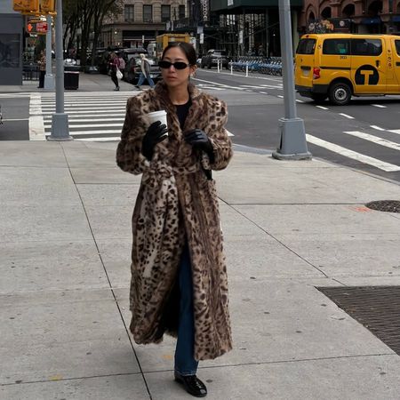 @aimeesong wearing jeans and animal print faux fur coat