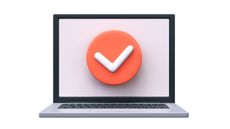 A white checkmark in a red circle on laptop screen.