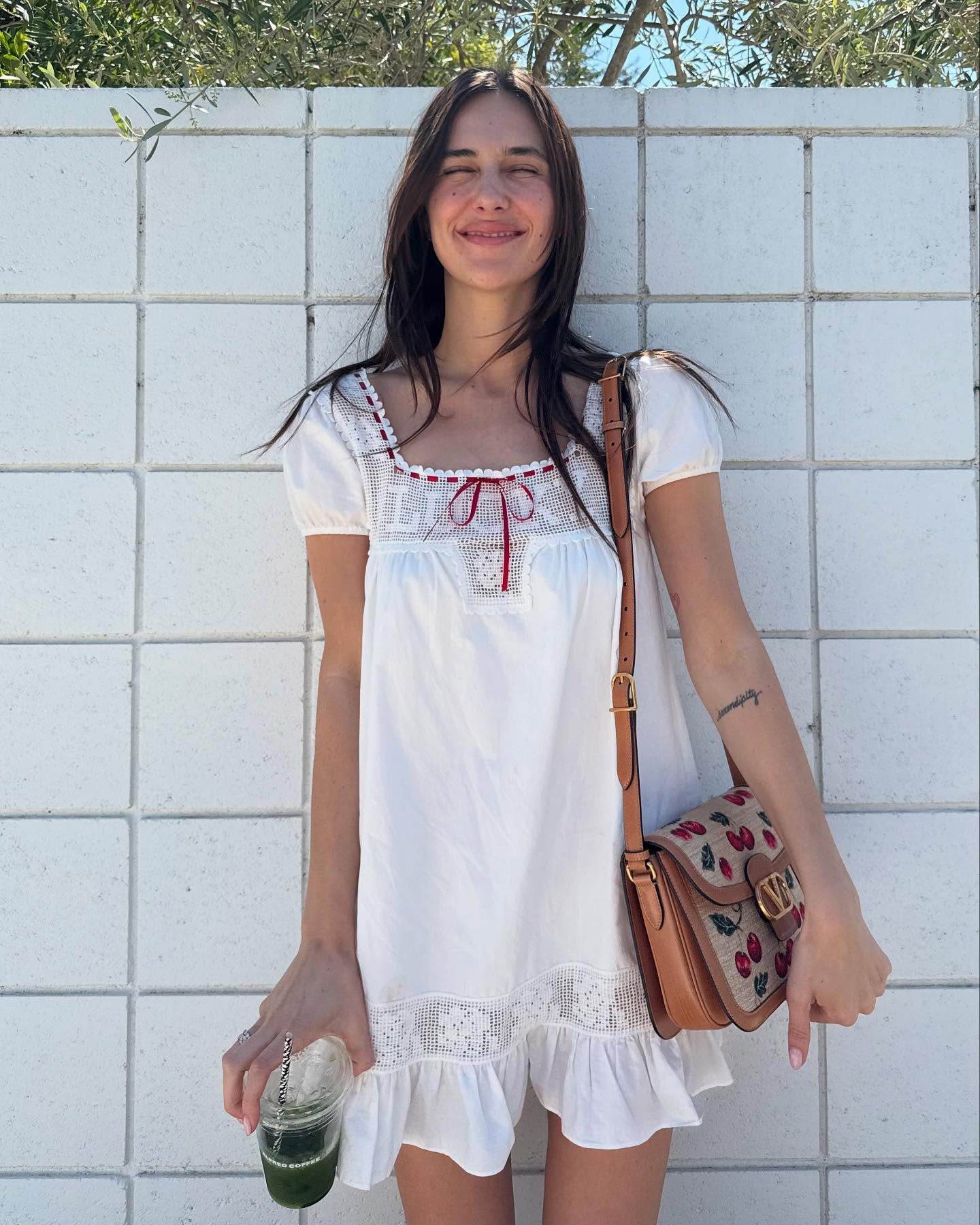 An image of @devonleecarlson wearing a musical festival outfit.