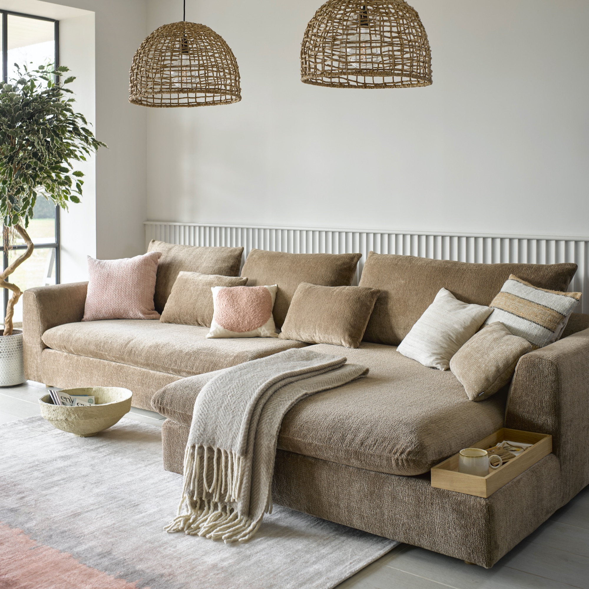 Pale living room with gold beige corner sofa