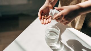 woman taking a supplement