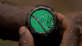 An AmazFit T-Rex 3 Smartwatch in the rain