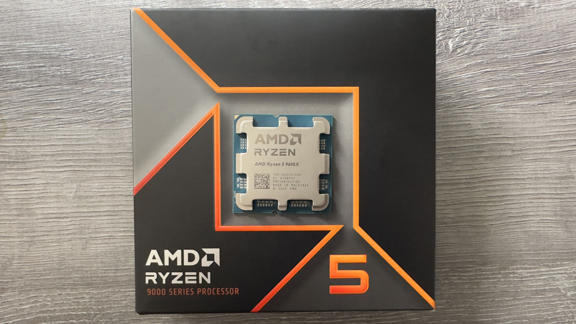 A photo of the retail packaging box for an AMD Ryzen 5 9600X processor