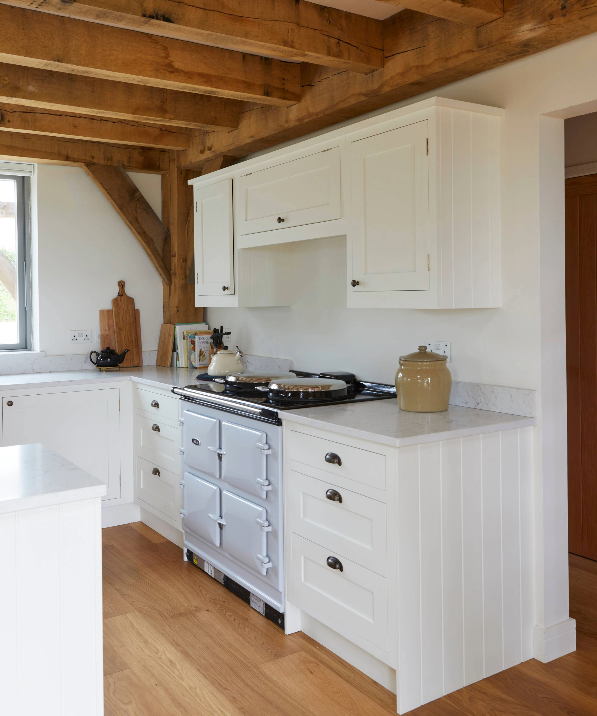 Kitchen with white cabinets and blue oven