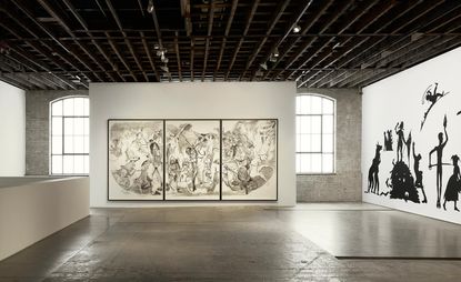 Large studio with monochrome artwork on walls