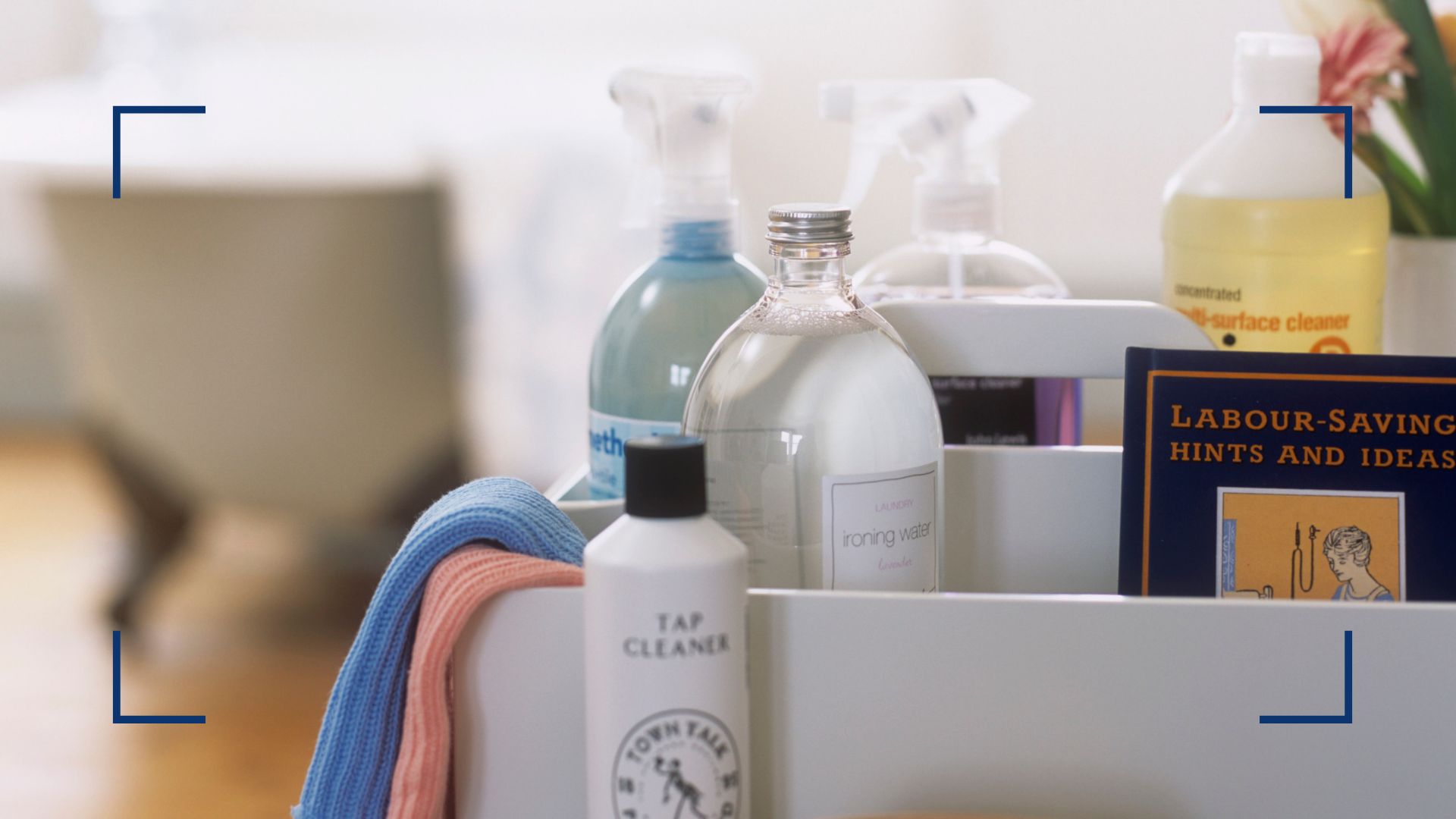 A caddy with cleaning products in a bathroom