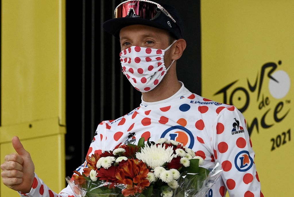 Team Israel Start Up Nations Michael Woods of Canada celebrates best climbers polka dot jersey on the podium at the end of the 14th stage of the 108th edition of the Tour de France cycling race 183 km between Carcassonne and Quillan on July 10 2021 Photo by Philippe LOPEZ AFP Photo by PHILIPPE LOPEZAFP via Getty Images