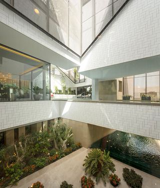‘The building is meticulously designed to wrap around the three gardens