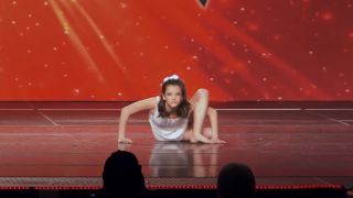 Brooke Hyland does acro work at the beginning of "Where Have All the Children Gone"