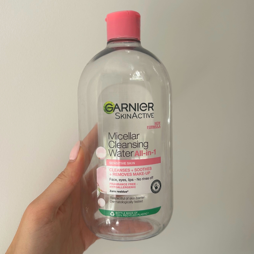 Hand holding empty bottle of Garnier Micellar Water