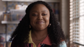 Quinta Brunson smiling as Janine in Season 3 of Abbott Elementary