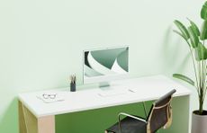 office setup with desk and chair in a green color scheme