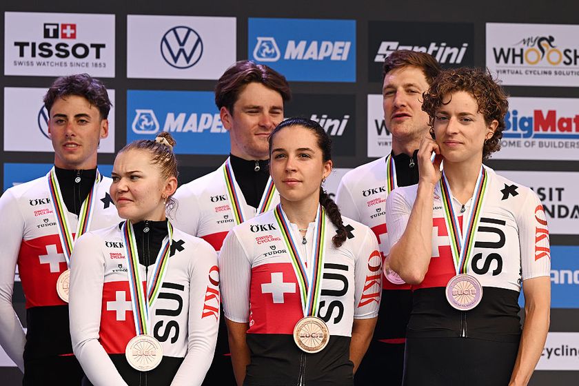 The Swiss team on the podium after winning bronze in the 2025 UCI Road World Championships team time trial mixed relay