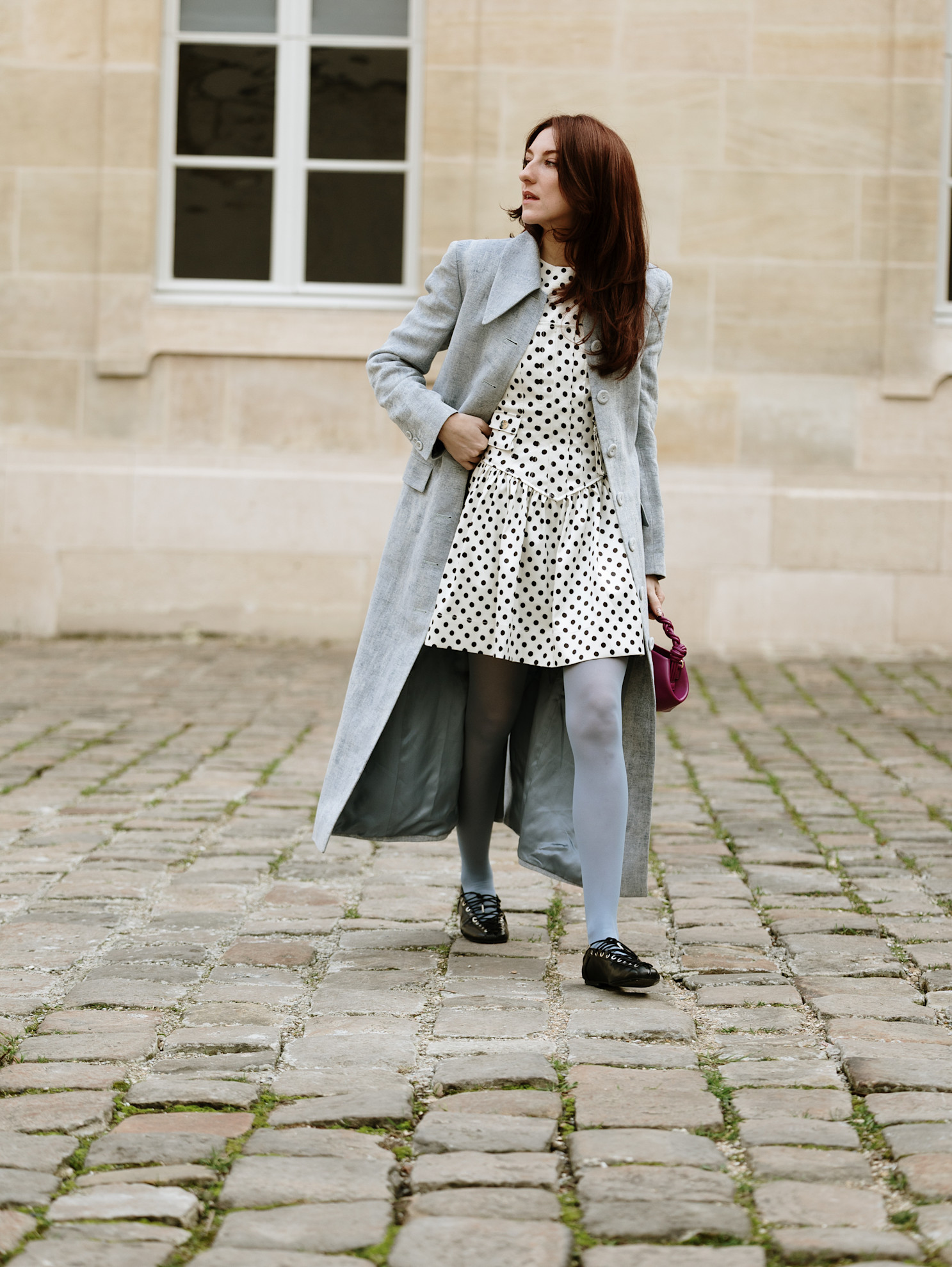 Woman wears a dotted dress on dab