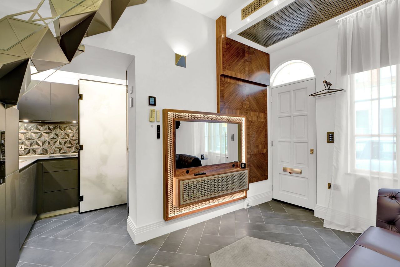 Another angle of the open plan living room and kitchen area in the small home