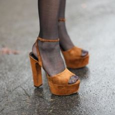 A winter pedicure trend alongside sheer stockings and block heels.