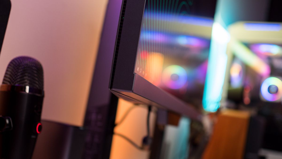 Side view of Redmagic 4K Gaming Monitor against RGB lighting