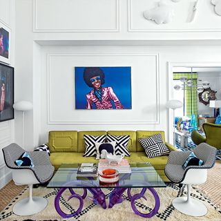 living room with white wall and yellow sofa