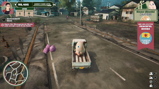 Driving through Kaso-Machi in Promise Mascot Agency with Pinky in the back of Michi's pickup truck - nearby are piles of trash