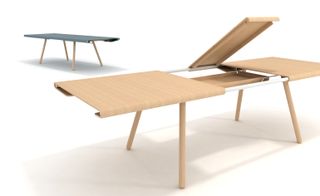 ’Stretch’ extending dining table by Pengelly Design Ltd, white room, two tables, one black and one natural wood demonstrating the extension mechanism