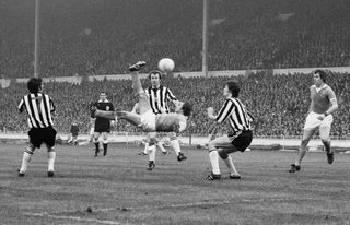 Manchester City's Dennis Tueart scores the winning goal for City in the 1976 League Cup final with a spectacular overhead kick