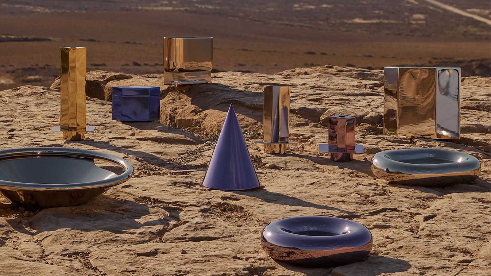 chrome shiny homeware objects in desert landscape