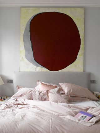 Large artwork over the bed