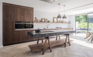 A modern kitchen with a cooks' kitchen island