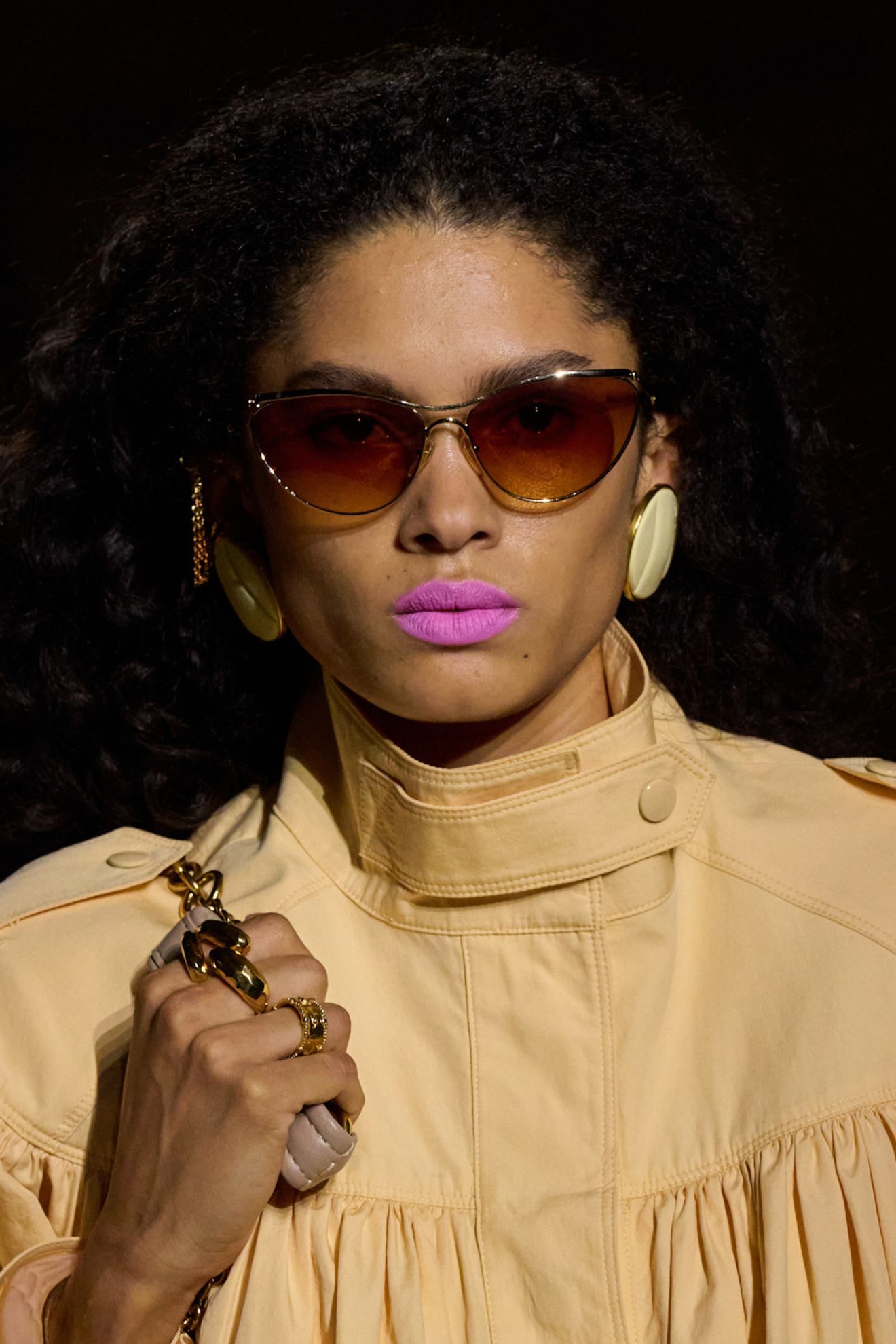 A model at the SS26 Chloe Paris show with bright pink lipstick