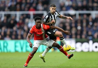 Albert Sambi Lokonga of Luton Town clashes with Bruno Guimaraes of Newcastle United during the Premier League match between Newcastle United and Luton Town at St. James Park on February 03, 2024 in Newcastle upon Tyne, England.