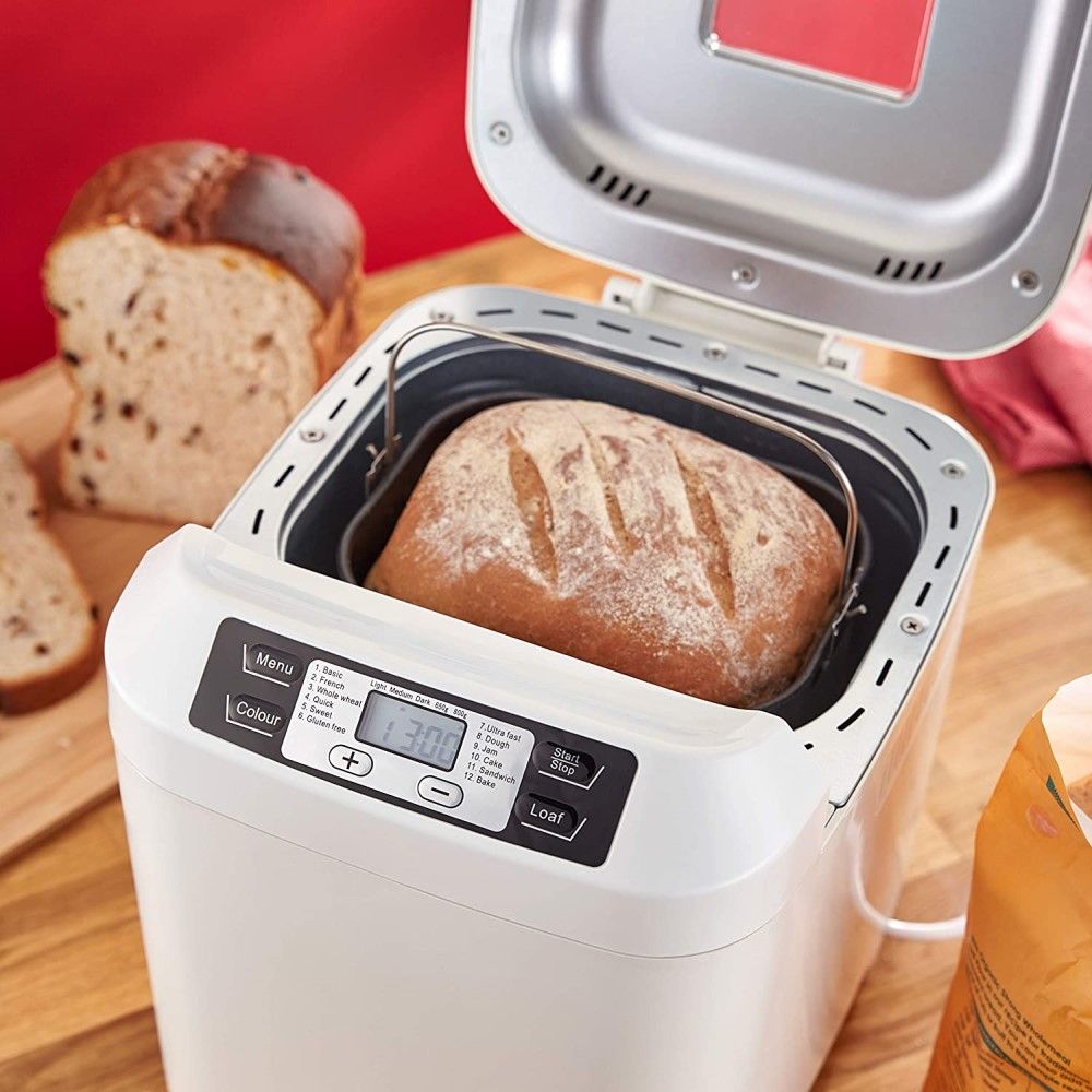 Baked bread inside Judge Electricals Digital Bread Maker on wooden counter