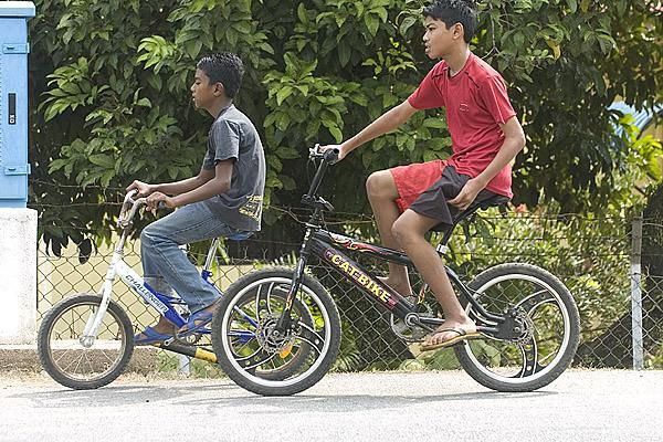 A couple of Malaysian cycling fans brought their own machines to the Tour de Langkawi on stage five from Muar to Port Dickson.