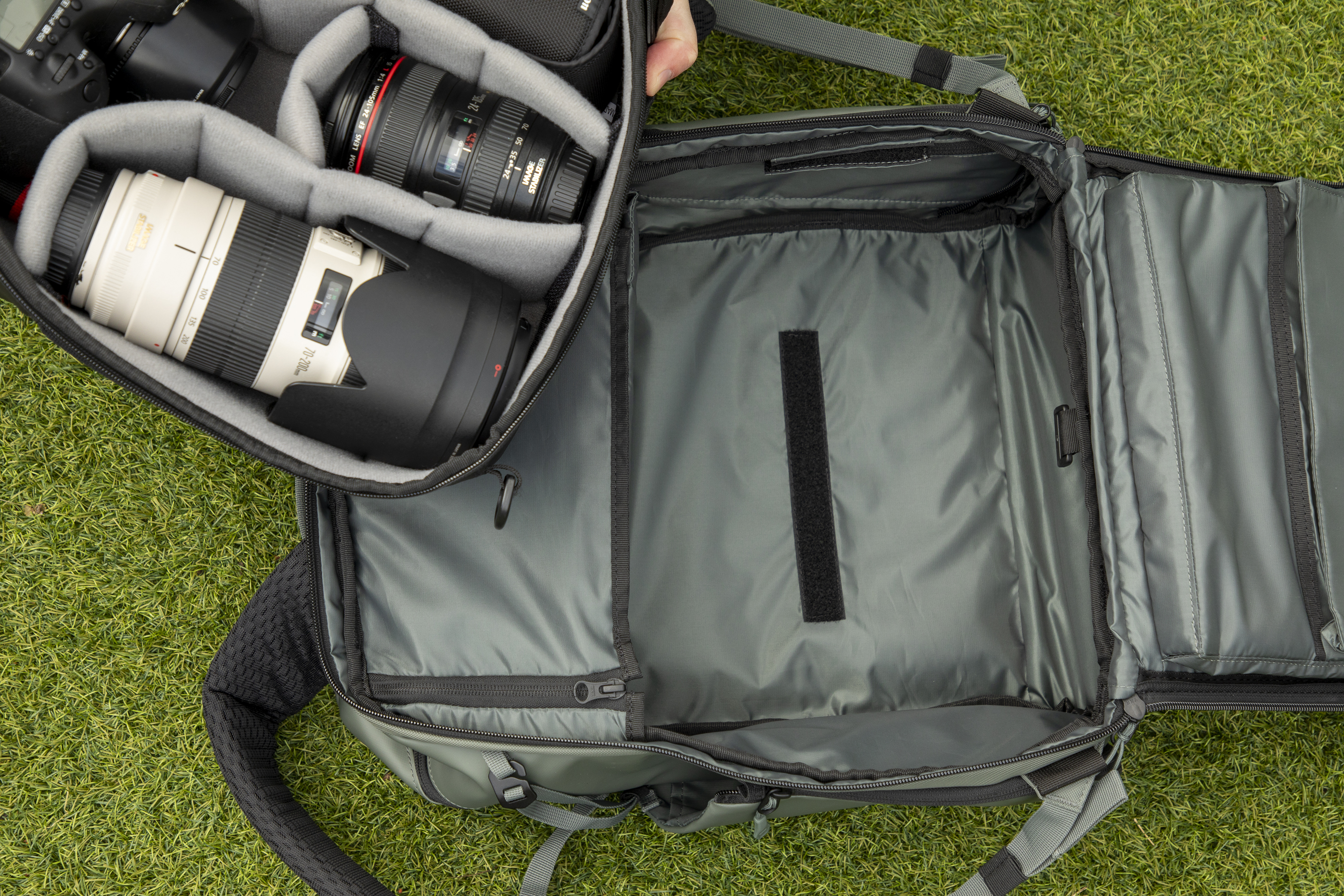 inside a camera backpack with internal dividers, being removed