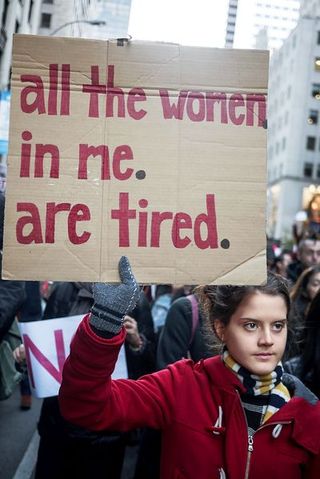 Protest, Public event, Street fashion, Rebellion, Banner, Tower block, Poster, Fur, Handwriting, Social work,