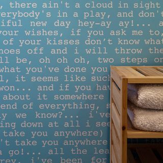 bathroom with blue wall and towels