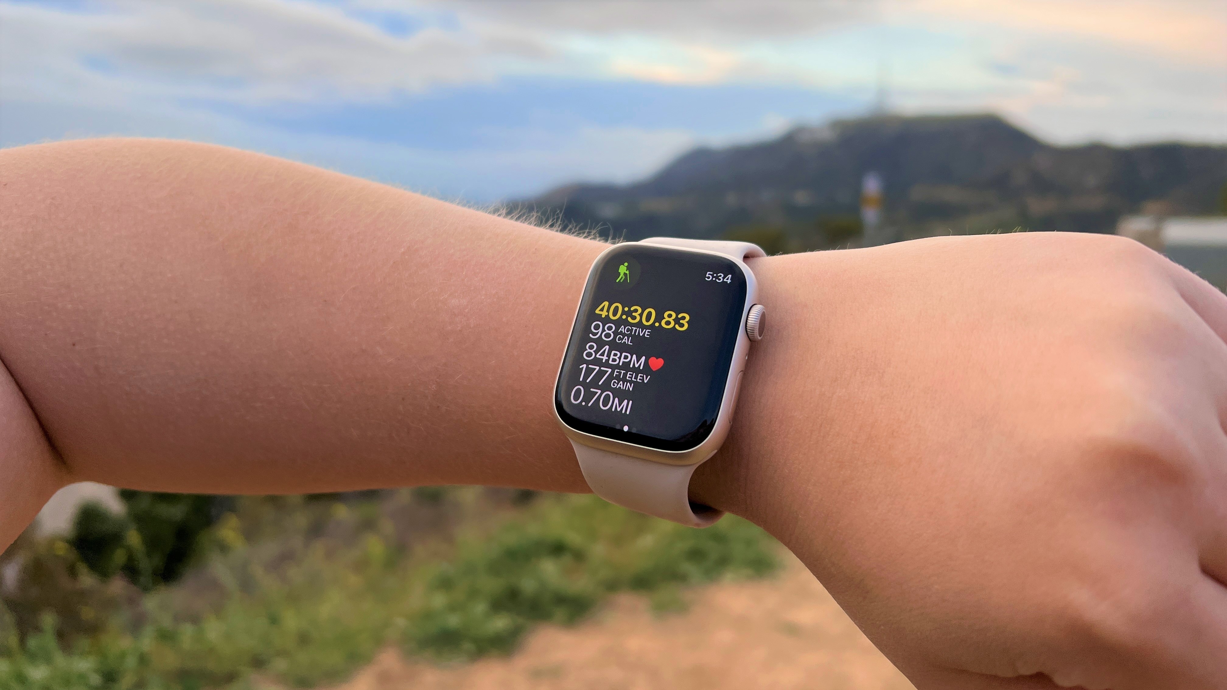 a photo of the Apple Watch 7 being used on a hike