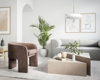 A living room with grey sofa, brown armchair, geometric beige coffee table