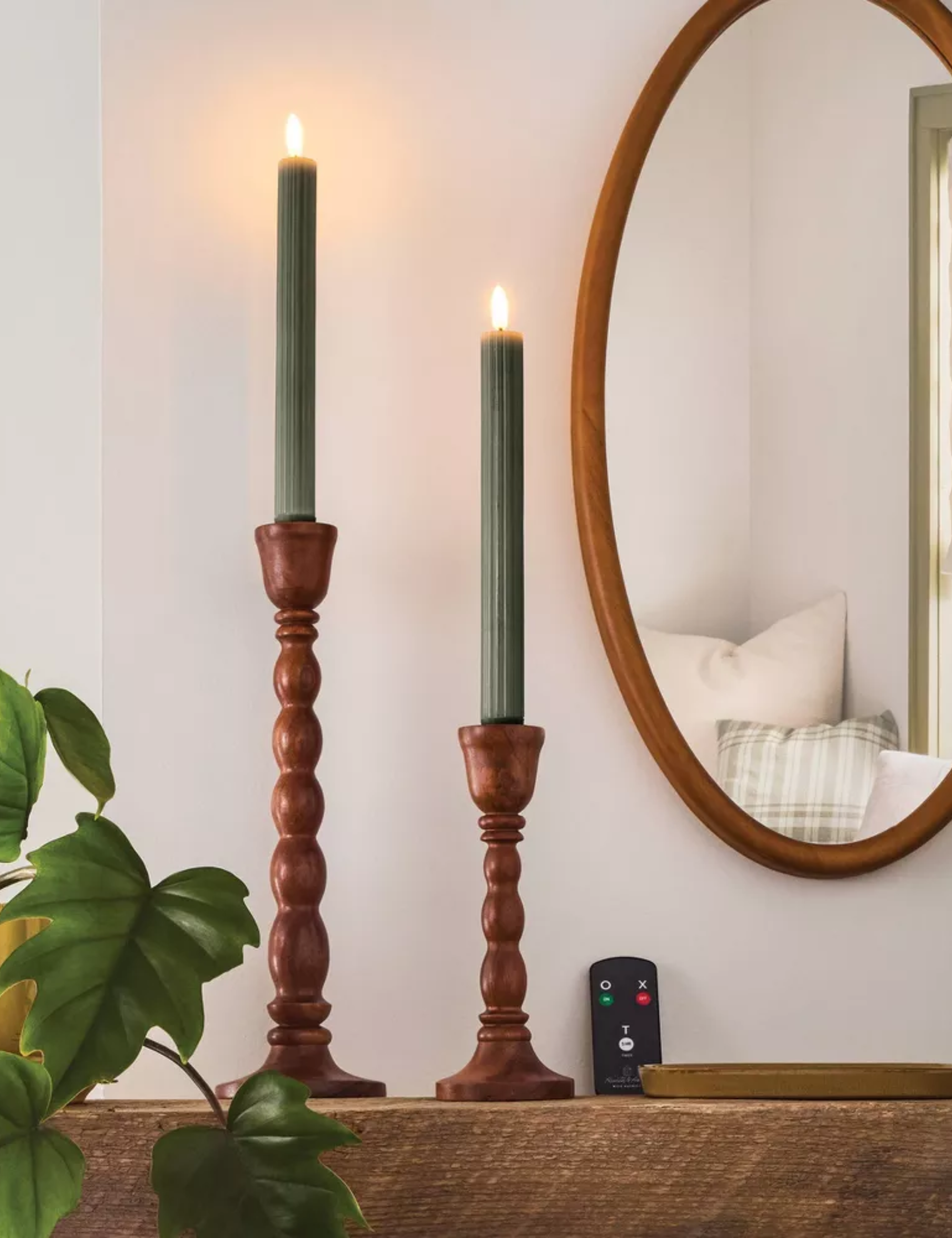 pair of green flameless ribbed taper candles