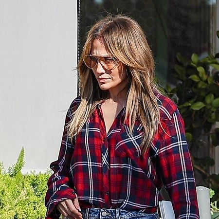 Jennifer Lopez wearing a red plaid shirt