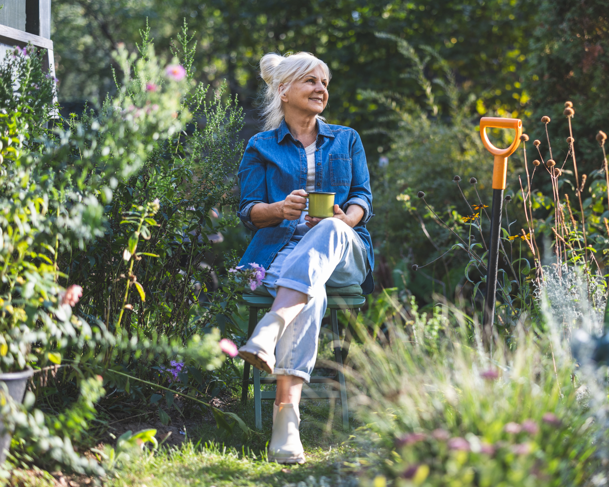 Senior woman drinking tea in garden