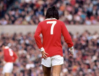 A photo taken from behind of George Best playing for Manchester United in 1971