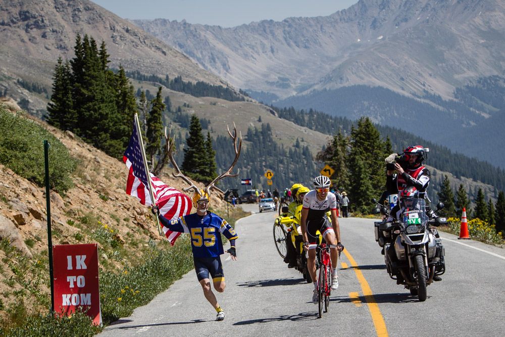 A fan cheers as Laurent Didier (Trek) hits 1K to go to the KOM