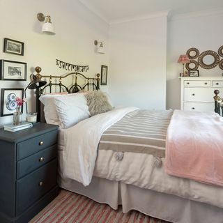 bedroom with white wall and bed