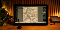 A drawing tablet on a wooden table