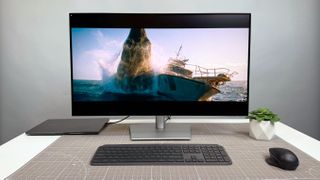 Dell UltraSharp 32 4K Thunderbolt Hub Monitor (U3225QE) on a white desk and gray background.